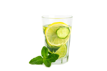 Cucumber water with lemon, lime and mint isolated on white background. Water infused with sliced ​​cucumber in a drinking glass. Tonic refreshing drink. Cucumber lemonade.Summer natural cooling drink