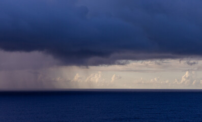 Dramatic Rainclouds Over the Pacific Ocean Highlighting Nature's Beauty
