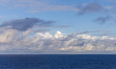 Scenic Skyline with Clouds Over the Vast Blue Pacific Ocean Horizon