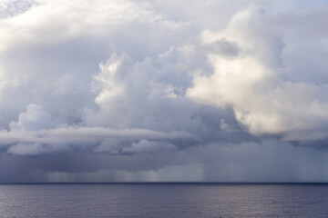 Dramatic Cloudscape Over the Tranquil Pacific Ocean Horizon Under Overcast Sky