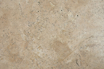 Polished beige marble stone texture closeup
