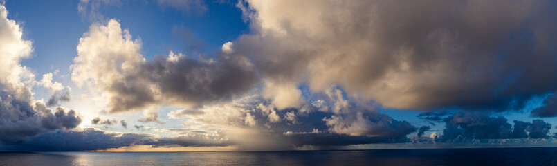 Dramatic Sunset Cloudscape Reflecting Over the Pacific Ocean Horizon