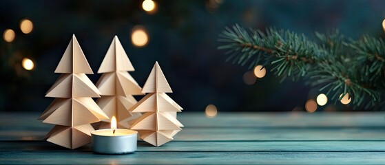 Festive paper Christmas trees with candlelight on a wooden surface.