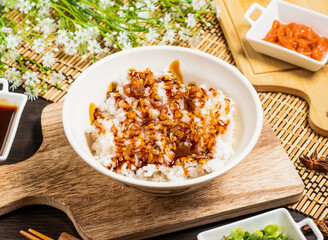 Lard Rice served in bowl isolated on wooden board side view of taiwan food