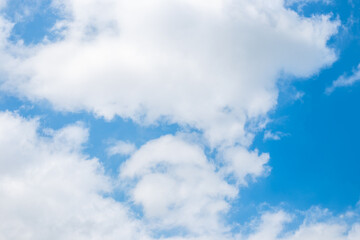 Cloudy sky with gaps of clear blue sky. Cloudy landscape, background
