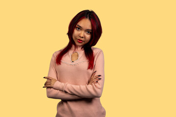 Obraz premium Confident young woman with red hair standing firmly
