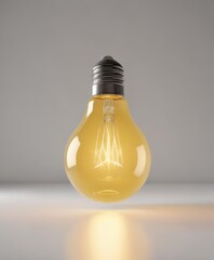 Bright yellow light bulb glows intensely against pure white ,  radiance,  illumination,  discovery