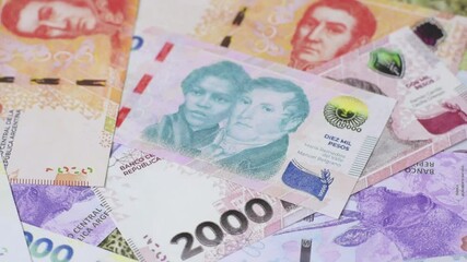 Background of Argentine peso paper money, notes with different denominations. Doing business, conceptual background - Powered by Adobe