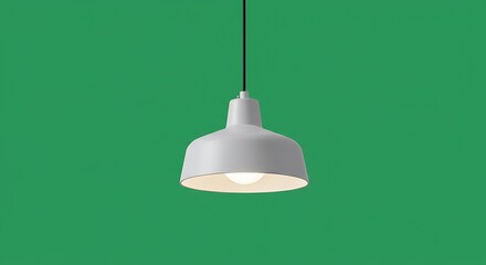 Obraz premium Minimalist pendant lamp illuminating against a vibrant green backdrop providing focus