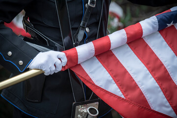 Color guard rolling up the US flag
