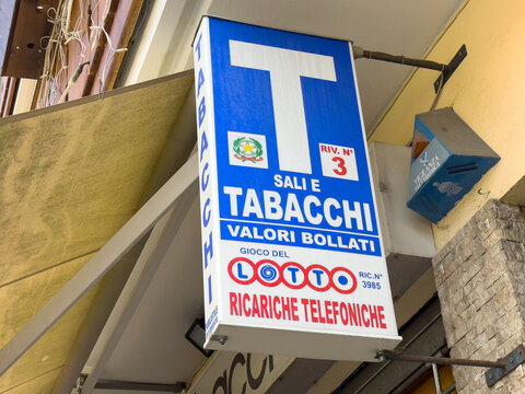 Italian tabacchi shop sign with lotto and telephone recharge options