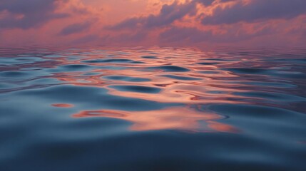 Obraz premium Beautiful landscape of a sunset over the ocean. the sky is filled with vibrant orange and pink hues, with the sun setting on the horizon and casting a warm glow over the water.