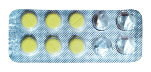 An overhead shot of a blister pack featuring bright yellow, round pills, with some compartments empty and crumpled, indicating partial use