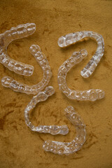 there are many pairs of transparent caps for alignment of the dentition and bite in patients