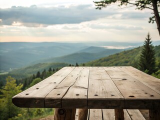 Fototapeta premium Wooden table on a mountain offers a scenic view of nature, sky, and lake for a relaxing outdoor picnic