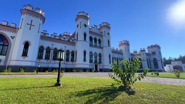 Belarus, Puslovsky Palace, September 5, 2024: Kossovsky Autumn Castle. An old historical castle in Kosovki in sunny autumn weather. An architectural monument in the style of English Neo-Gothic. 4K