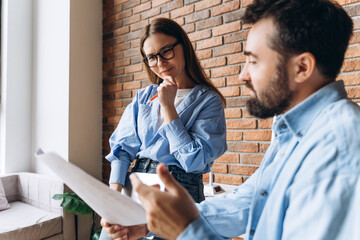 Business partners discussing project in modern office