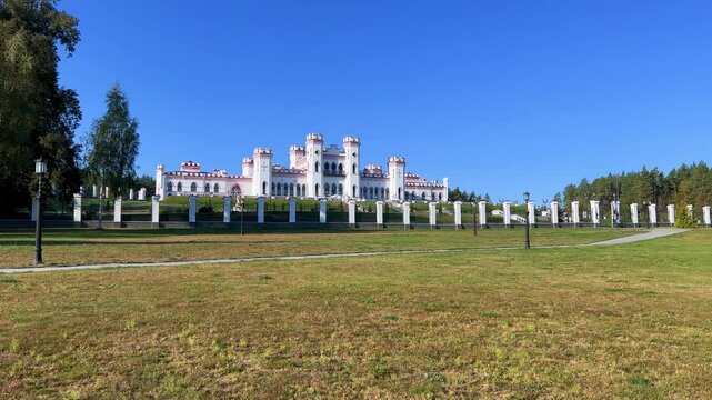 Belarus, Puslovsky Palace, September 5, 2024: Kossovsky Autumn Castle. An old historical castle in Kosovki in sunny autumn weather. An architectural monument in the style of English Neo-Gothic. 4K