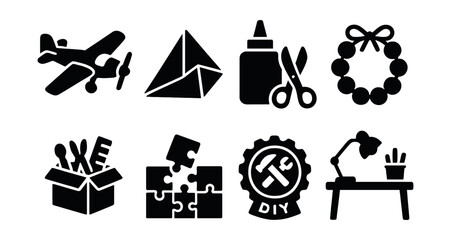 Solid style icons of hobby and craft play: model airplane, paper folding, glue and scissors, beading icon, creative box, puzzle construction, DIY badge, craft table.