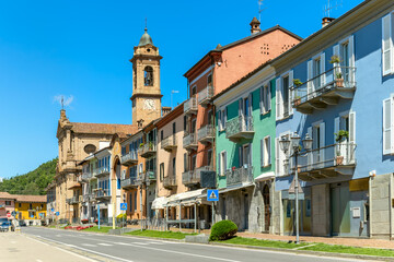 A vibrant street scene and colorful buildings in Corneliano d'Alba, Piedmont, Italy.