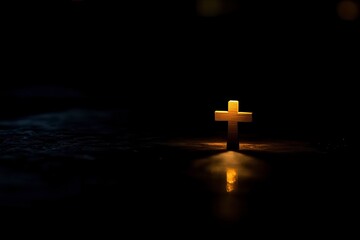 Glowing Wooden Cross on Dark Reflective Surface at Night