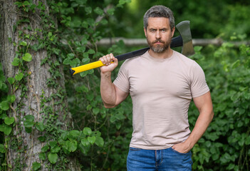 Hispanic lumberjack man with axe. Lumberjack axe. Man with logging axe. Masculine brutal man....