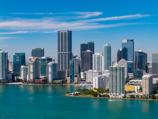 Naklejka premium Brickell skyline with skyscraper architecture. City skyline. Waterfront city. Miami from Brickell Key in Florida. Skyscraper in downtown city. Cityscape skyline. Brickell building in Miami downtown