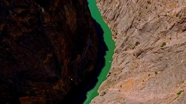 Aerial Footage of Base Jumping from a Cliff Over a River