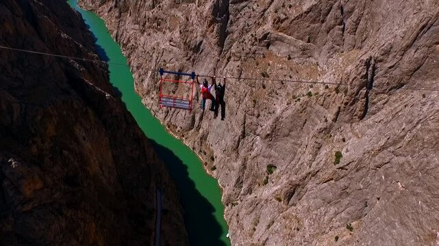 Extreme Jump from Canyon Platform into River with Parachute Deployment, Aerial View
