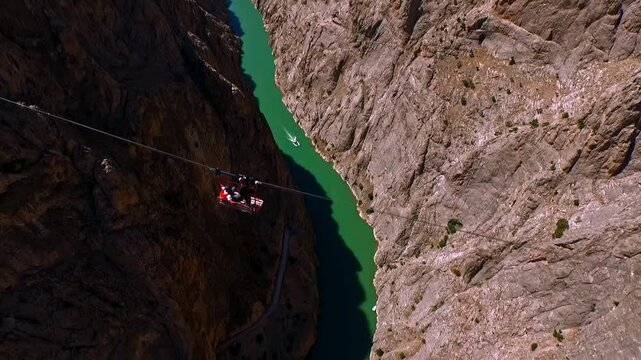 Extreme Jump from Canyon Platform into River with Parachute Deployment, Aerial View
