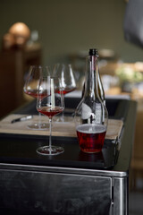 Decanter for sparkling wine on the table, Champagne tasting, Wine glasses and bottle, reflections, rose wine