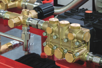 Copper block with valves on industrial air compressor, industrial concept background