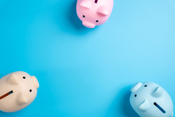 The piggy banks look with interest at the center of the copy space. Attracting investors. Diversification of savings. Attracting attention to financial opportunities. Wealth building