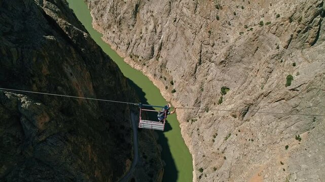 Extreme Jump from Canyon Platform into River with Parachute Deployment, Aerial View