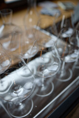 Clean wine glasses are on the table of a special wine cabinet, stylish table setting, ice, bottle...