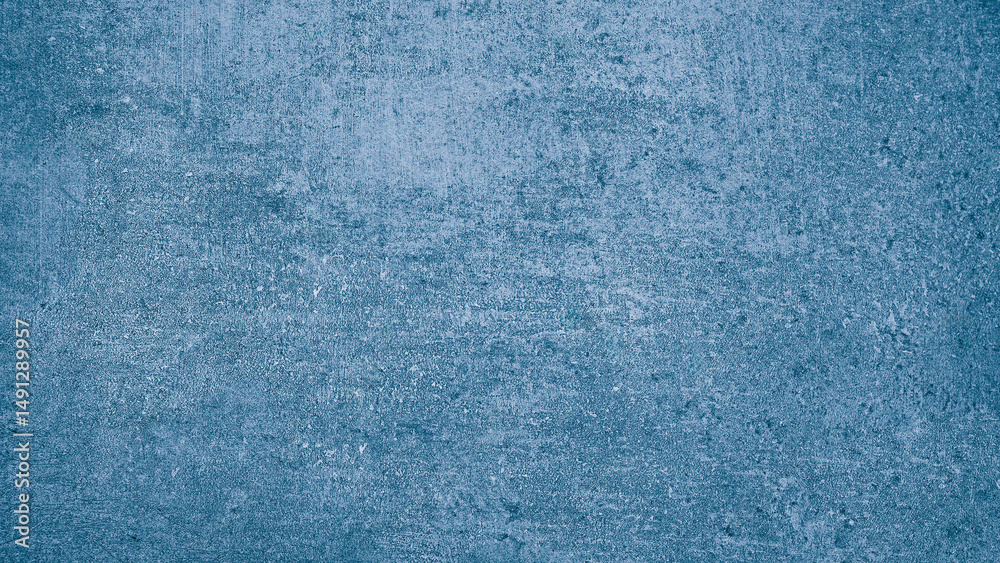 Poster wall deep shade of blue with rough, textured surface. blue color is bold and stands out against the rough texture, creating striking contrast abstract texture background for template pages and banners