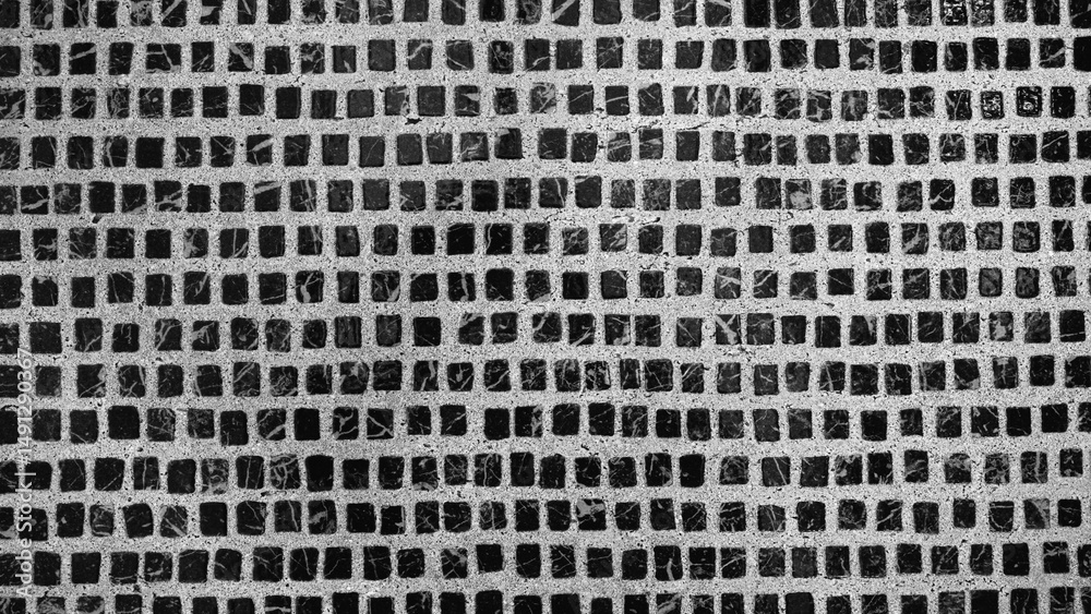 Leinwandbilder a black and white photo of a tiled floor with a pattern of squares. the photo has a moody and somewh
