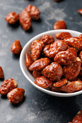 Caramelized almonds. Toasted almonds coated with caramel syrup.