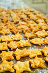 Pastelitos, traditional Argentine flaky snack, especially eaten on national holidays, freshly fried and ready to eat.