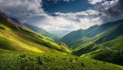 Obraz premium lush valley surrounded by majestic mountains under dramatic clouds in a scenic landscape