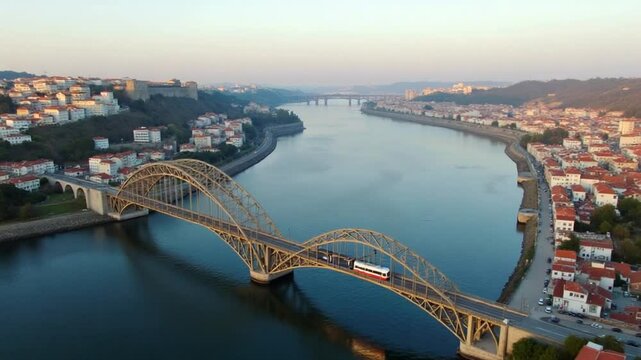 Porto City, Douro River and Dom Luis Bridge I with Tram in the Morning. Portugal. Vila Nova De Gaia. Aerial Drone Shot. Moving Backwards and Upwards. Vertical