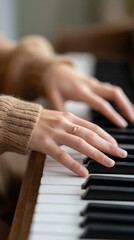 Obraz premium Teen girl practicing piano with metronome in cozy sweater for music education