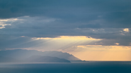 Sunset sky. Dramatic sky view. Sunlight over the sea