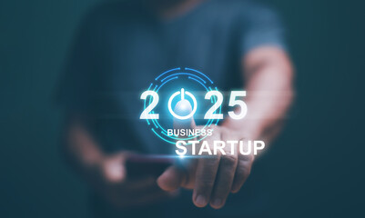 Business startup concept. Businessman touch turn on icon for start new business on 2025. Planning and strategy business start and growth to success or rising successful development in the future.