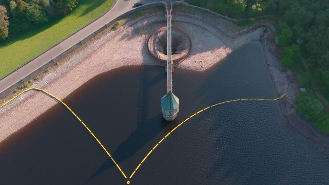 4k Aerial footage of Pontsticill Reservoir spillway plug hole Wales Uk. beautiful welsh landscape