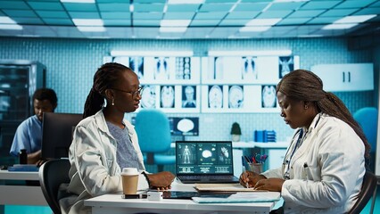 General practitioner prescribing antibiotics and vitamins on an insurance paper, recommending the right dosage for list of medicaments and painkillers. Medical prescription. Camera B.