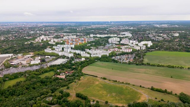 Air shot showing the residential blocks of M&auml;rkisches Viertel beside the open green spaces of Freizeitpark L&uuml;bars in Berlin's Reinickendorf district.