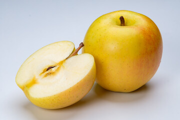 a whole flesh yellow-red orin apple isolated in white background with clipping path