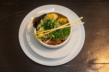 Traditional Japanese ramen or ramen with vegetable broth, grilled pork, oriental noodles and classic Japanese cuisine spices