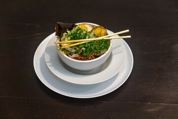 Traditional Japanese ramen or ramen with vegetable broth, grilled pork, oriental noodles and classic Japanese cuisine spices